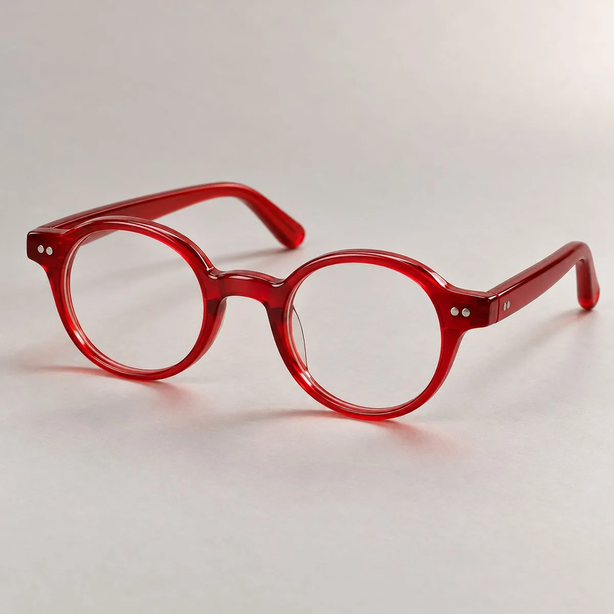 Piccola montatura rotonda per bambini in acetato rosso ciliegia lucido Piccola montatura rotonda per bambini in acetato rosso ciliegia lucido